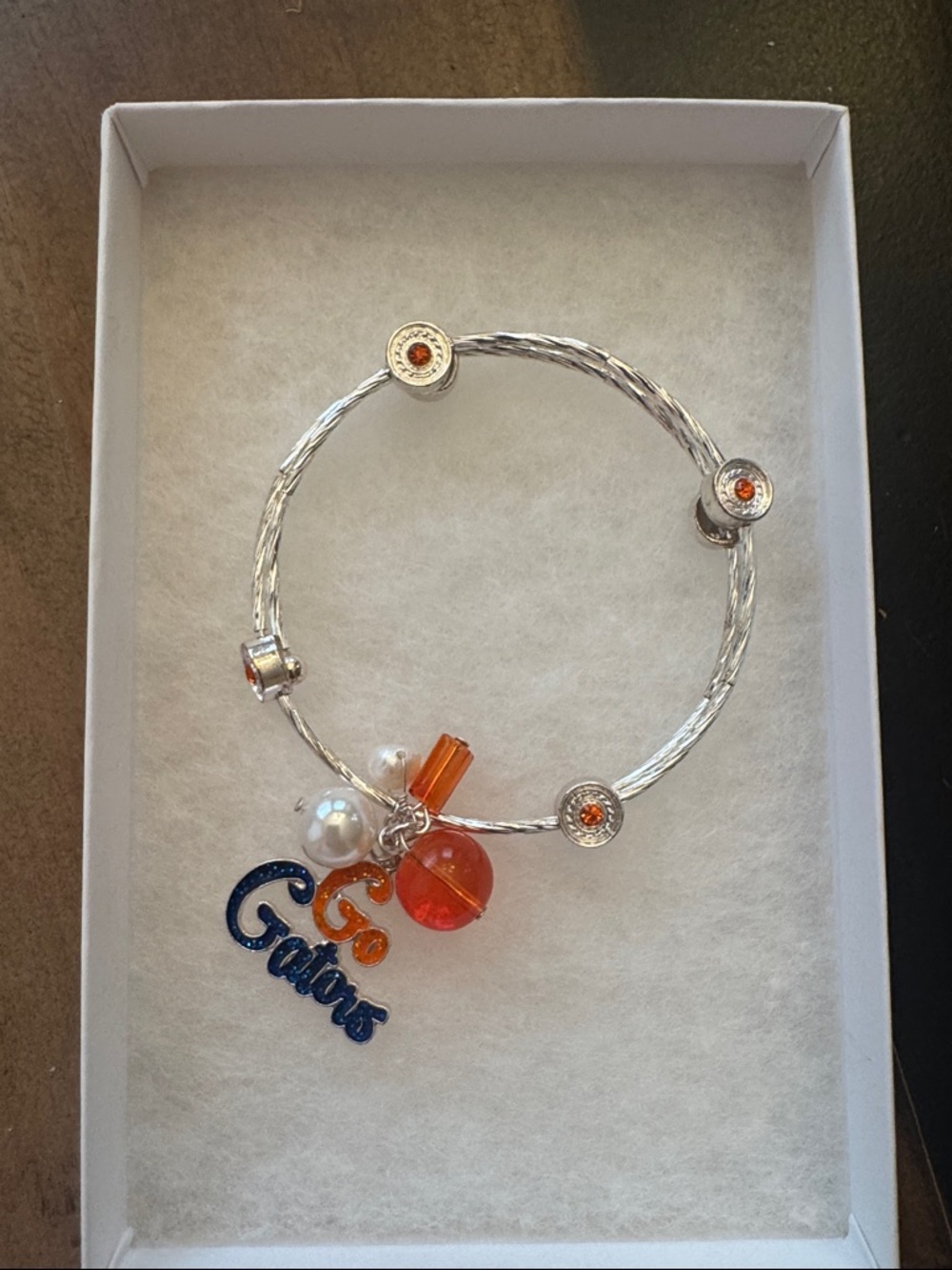 Silver Bangle Bracelet with Gator Orange and Blue Charms